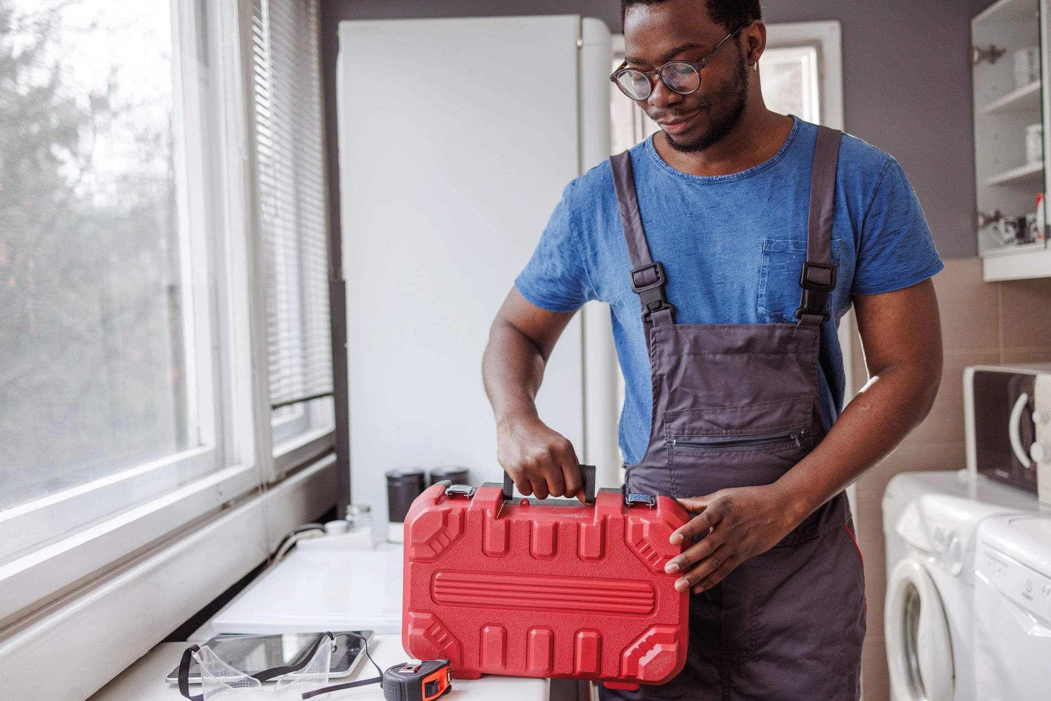 Emergency plumbing technician ready with tools