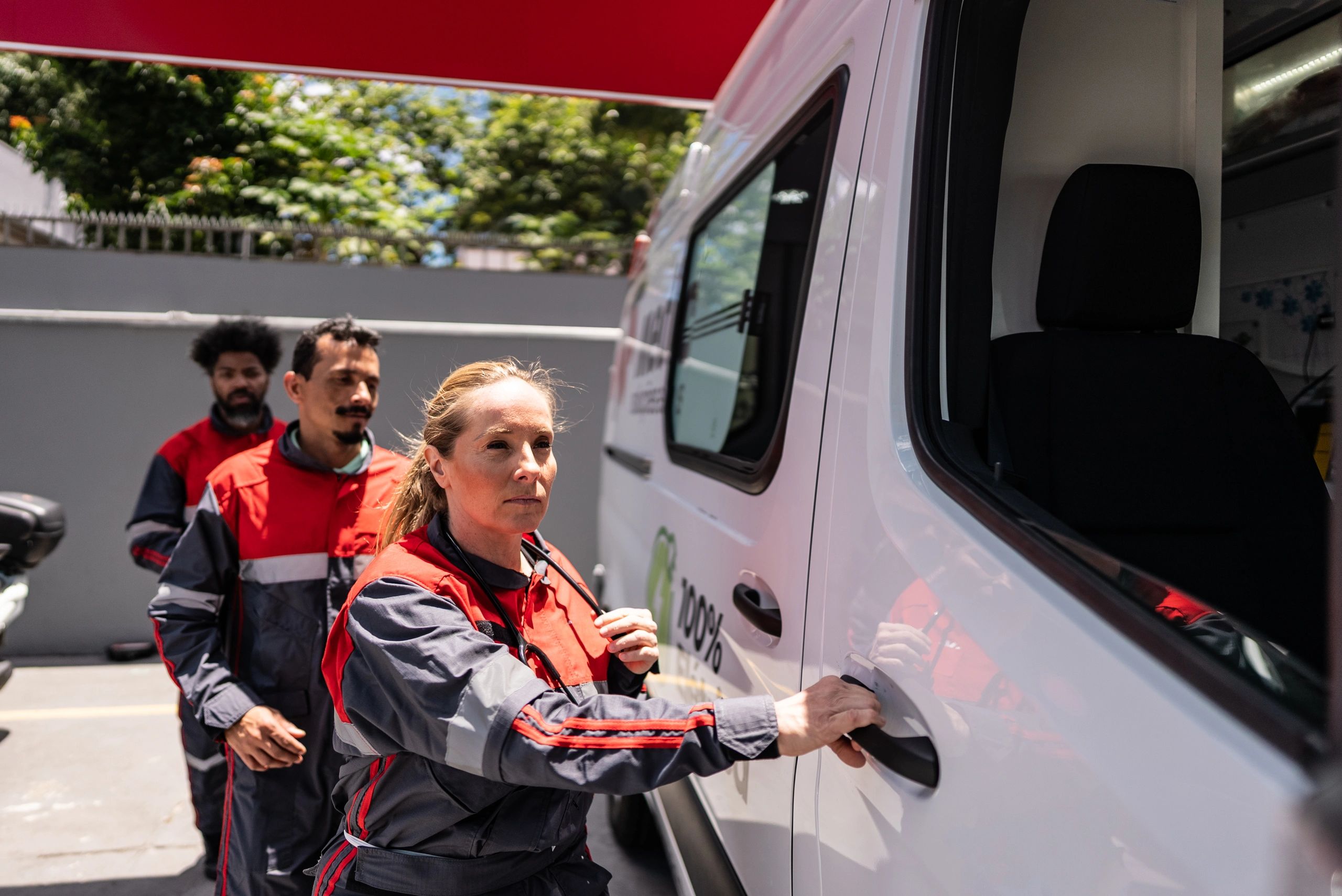 Service crew beside a work vehicle